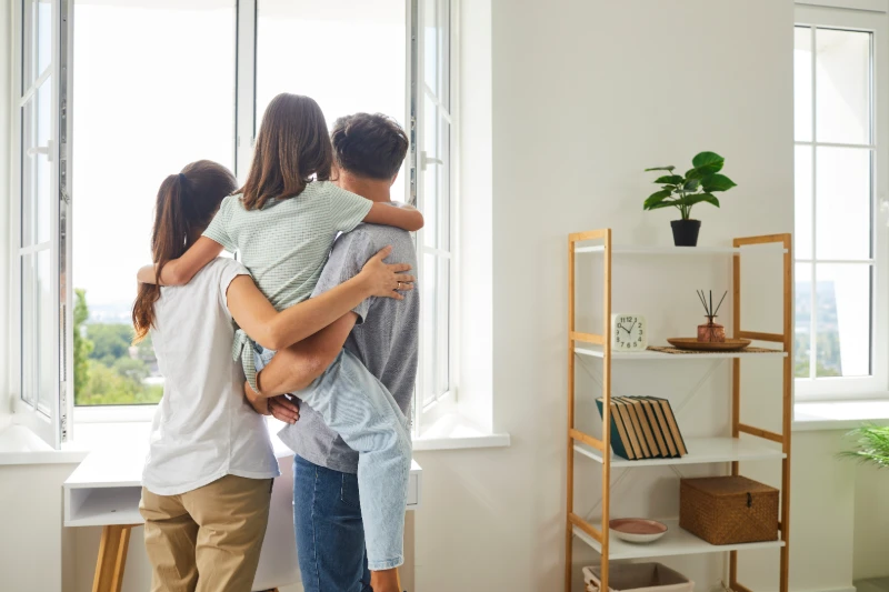 Understanding Closing Costs: What Every Buyer Should Know 1 family looking out window